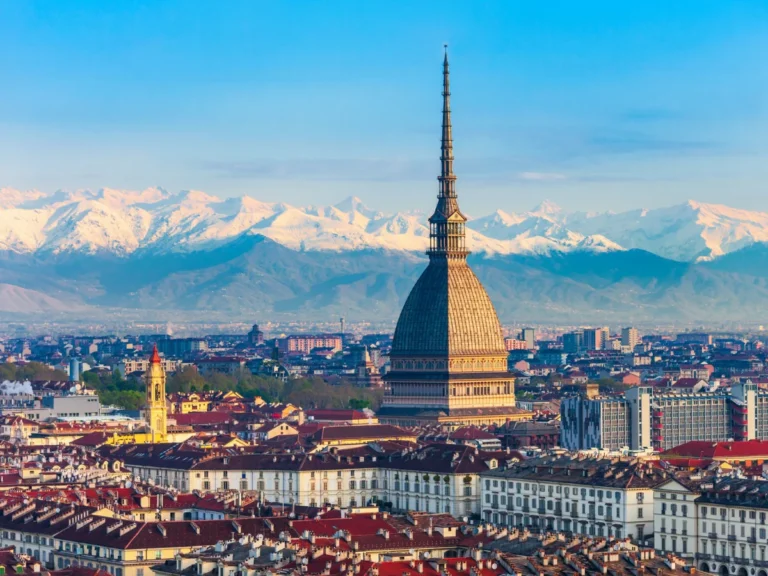 View of Mole Antonelliana in Turin and the Alps in the background